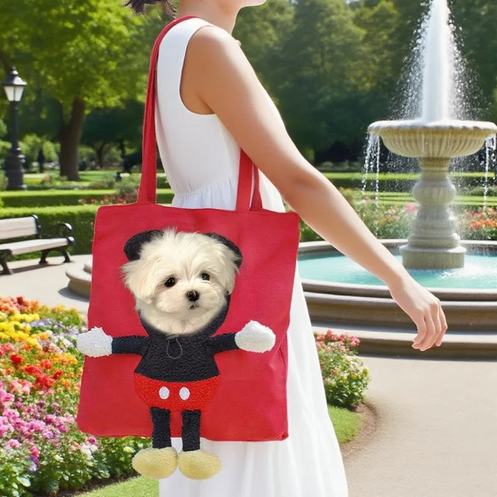 Small dog resting in a red pet carrier