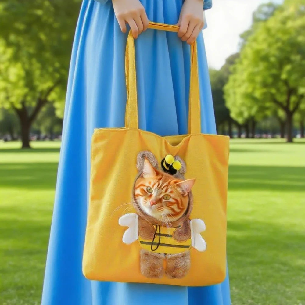 Kitten resting in a yellow bee-shaped pet carrier