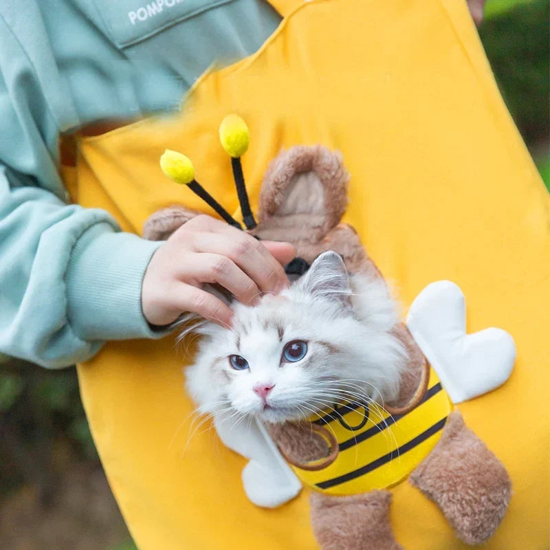 Small pet nestled inside the soft cotton carrier